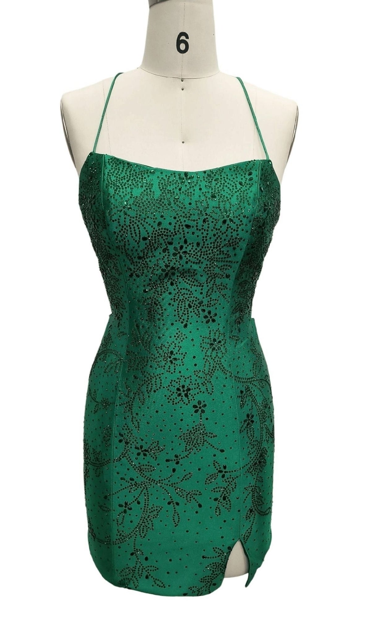 Tight Green Short Hoco Dress: 12414—green satin mini dress with thin straps, subtle side slit, and black sequin floral accents on display. An elegant choice for parties or your next celebration.